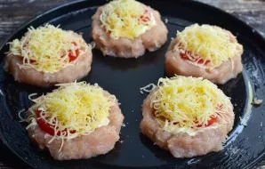 Grate hard cheese on a fine or coarse grater. Put it on tomatoes.