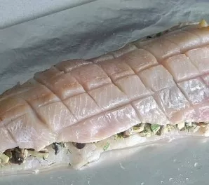 Place the second piece of fillet on top of the filling. Press gently. We make incisions in the upper fillet (as in the photo). Drizzle wi...