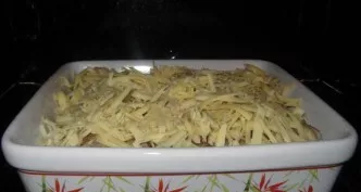 Put the prepared rolls in a baking dish and pour over the wine. Grate hard cheese on a coarse grater. Sprinkle with cheese on top of the ...