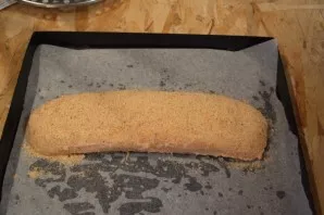 Place the roll on a baking sheet, sprinkled the roll with breadcrumbs. Preheat the oven to 200 degrees and bake the roll in the oven unti...