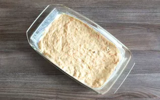 Grease the baking sheet with a thin layer of butter. Pour in the dough and bake in a preheated oven at 180 degrees for 50-55 minutes.