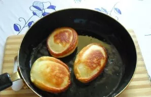 Turn the pancakes to the other side.