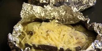 Then carefully unfold the envelope and sprinkle with grated cheese on top. Put in the oven again to bake until cooked.