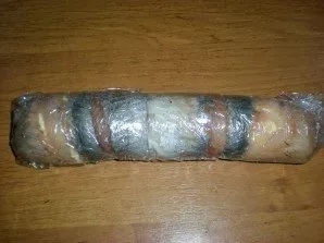 Using a loose piece of cling film on the edge, wrap the roll, pressing it hard. Then it is possible to additionally wrap it in a sheet of...