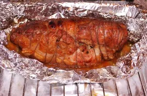 The roll should be baked in the oven for about 2 hours at medium temperature. If you want to get an appetizing crust, you can carefully u...