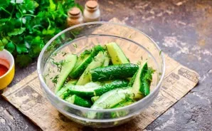 Mix everything and leave the cucumbers for a day in the refrigerator, periodically remove and stir.