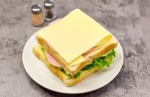 Put the remaining cheese on top of the sausage.