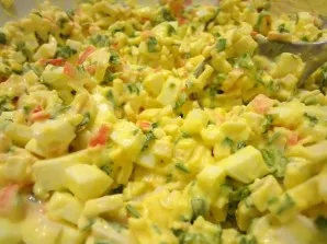 Add crab sticks and herbs to the eggs. Mix everything thoroughly and season with mayonnaise. If desired, you can use sour cream and musta...
