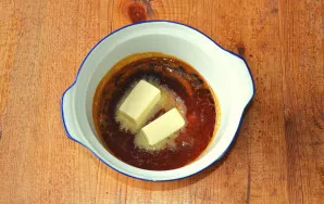 Dissolve sugar. I keep it on the fire a little longer to get a more intense flavor. Put butter in the melted sugar.