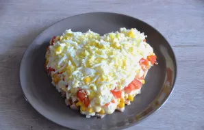 Another layer of finely chopped or grated boiled eggs, then mayonnaise again.