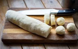 Roll this dough into sausage and cut into equal pieces from which to roll out the balls. The weight of my one such ball is 23-25 grams.