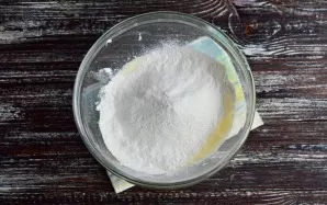 Add the sifted flour.