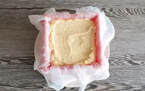 Cover the container with clean cheesecloth so that its ends slide over the torot shape. Pour the curd mass into the mold and press the to...