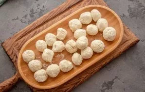 Roll each piece of dough into a small ball.
