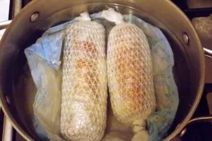 Pour water into the pot, place a towel on the bottom. Place the wrapped breasts on it and boil the water. Reduce heat to low and simmer f...