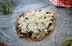 Put the remaining cheese on top of the mushrooms.