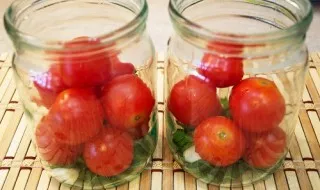 Fill half of the jar with cherry tomatoes.