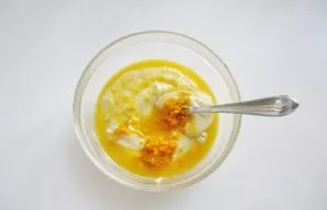 Divide the dough into two parts. Grate the orange peel and squeeze the juice. In half the dough, add 2-3 tablespoons of juice and a table...