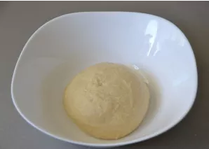 Grease the bowl with vegetable oil, put the dough in the bowl and cover it with cling film. Leave to stand for about 1.5 hours until doub...