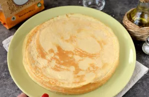 Stack the finished pancakes on a large flat dish.