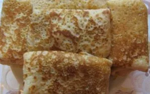 Roll the pancake into a roll or an envelope shape.