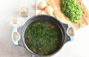 Add nettle to the boiling soup and cook for 2 minutes.