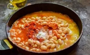 Add tomato, salt, sugar, bell pepper.