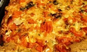 After the cheese has melted and the dough has hardened a little, the pizza can be taken out of the oven.