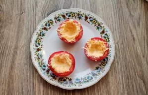 Wash and dry the tomatoes. Cut the bottom of the tomatoes from the stem side. Use a small spoon to remove the pulp and seeds. Put some ch...