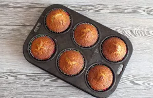 After the specified time, check if the cupcakes are cooked by inserting a toothpick into the middle. If baked, remove the cupcakes from t...