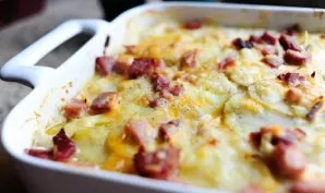 Cover the container with foil and bake for 40 minutes. Remove the foil and bake for another 20 minutes. Cut into squares, if desired, spr...