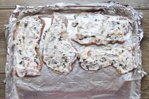 Grease vegetables and meat with mayonnaise.