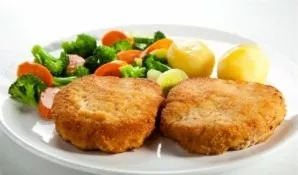 Preheat oven to 180 degrees. Transfer the schnitzels to a baking sheet, put in the oven for 10 minutes. After that, pull it out, let stan...