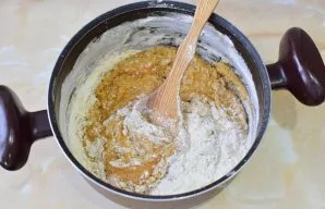 Gradually add flour to the cooled mass. The result should be a thick mass of honey, which still sticks to the hands. Cover the dough with...