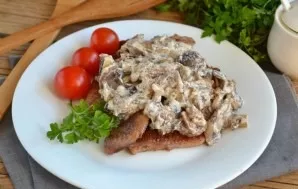 The meat with mushroom sauce is ready. Put pork on a plate, put mushroom sauce on top. Serve as a separate dish with vegetable puree or p...