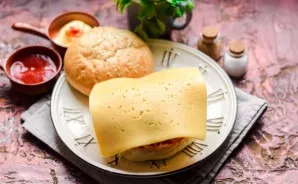 Put on the cheese and the second half of the bun.