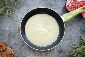 While stirring all the time, pour in hot milk. Cook over low heat until thickened, add salt at the end.