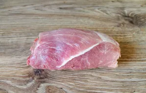 Roll the prepared meat into a tight roll.