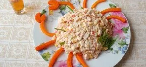 Carefully assemble the salad into a round mound. Arrange the chopped carrots in such a way as to form legs and claws, and form eyes and t...