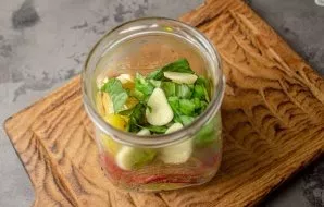 Put paprika, basil, and garlic in a clean, sterilized jar.