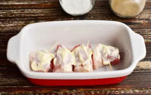 Place the rolls in a baking dish. Grease them with mayonnaise on top.