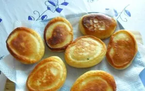 Put the pancakes on a napkin to absorb excess fat.