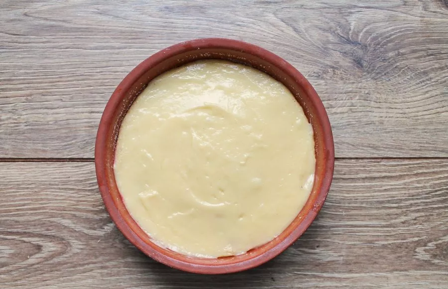 Pour the rest of the dough over everything and smooth the top.