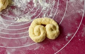 Roll each into sausage, then turn both edges of it to the center.