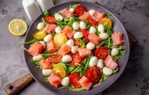 Cut salmon without skin and bones into small pieces, lay out on top of the salad. Sprinkle the salad with the remaining sauce and serve i...