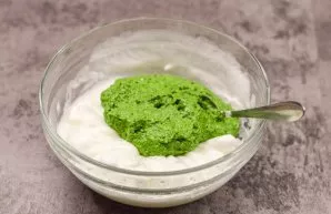 Pour the spinach mixture into the egg whites and add salt and pepper to taste.