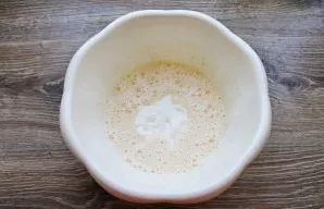 Pour the sour cream into the bowl with the beaten eggs.