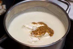 Return the grated soup back to the pot. Add sour cream and mustard.