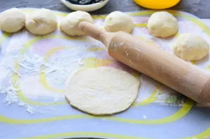 Roll out each ball with a rolling pin.