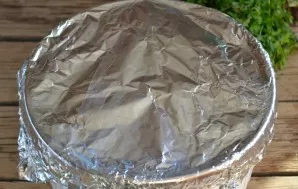 Cover the baking form with foil and put it in the oven for 30 minutes. Serve the chicken fillet with potatoes with tomatoes and a sprig o...